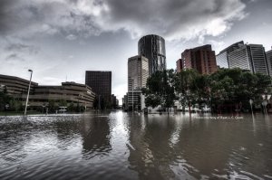 Picture of Downtown Calgary Flooded with clouds hovering over.