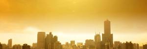 City skyline with bright sun